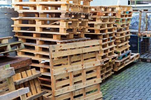 Crews wearing high-visibility PPE handling waste safely during a removal